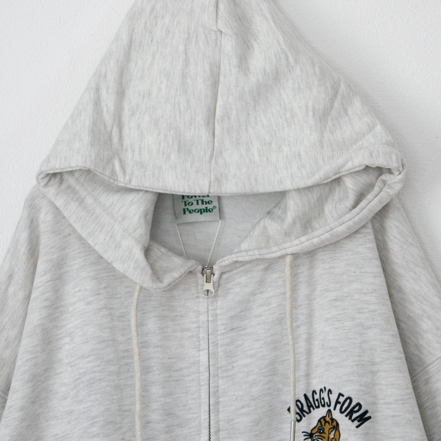 POWER TO THE PEOPLE TIGER ZIP hoodie in KINARI WHITE