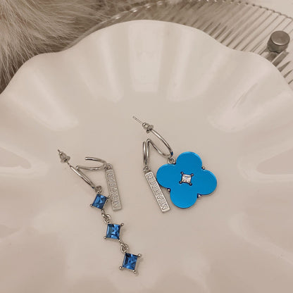 METALLIC FLOWER ASYMMETRIC EARRINGS BLUE SILVER
