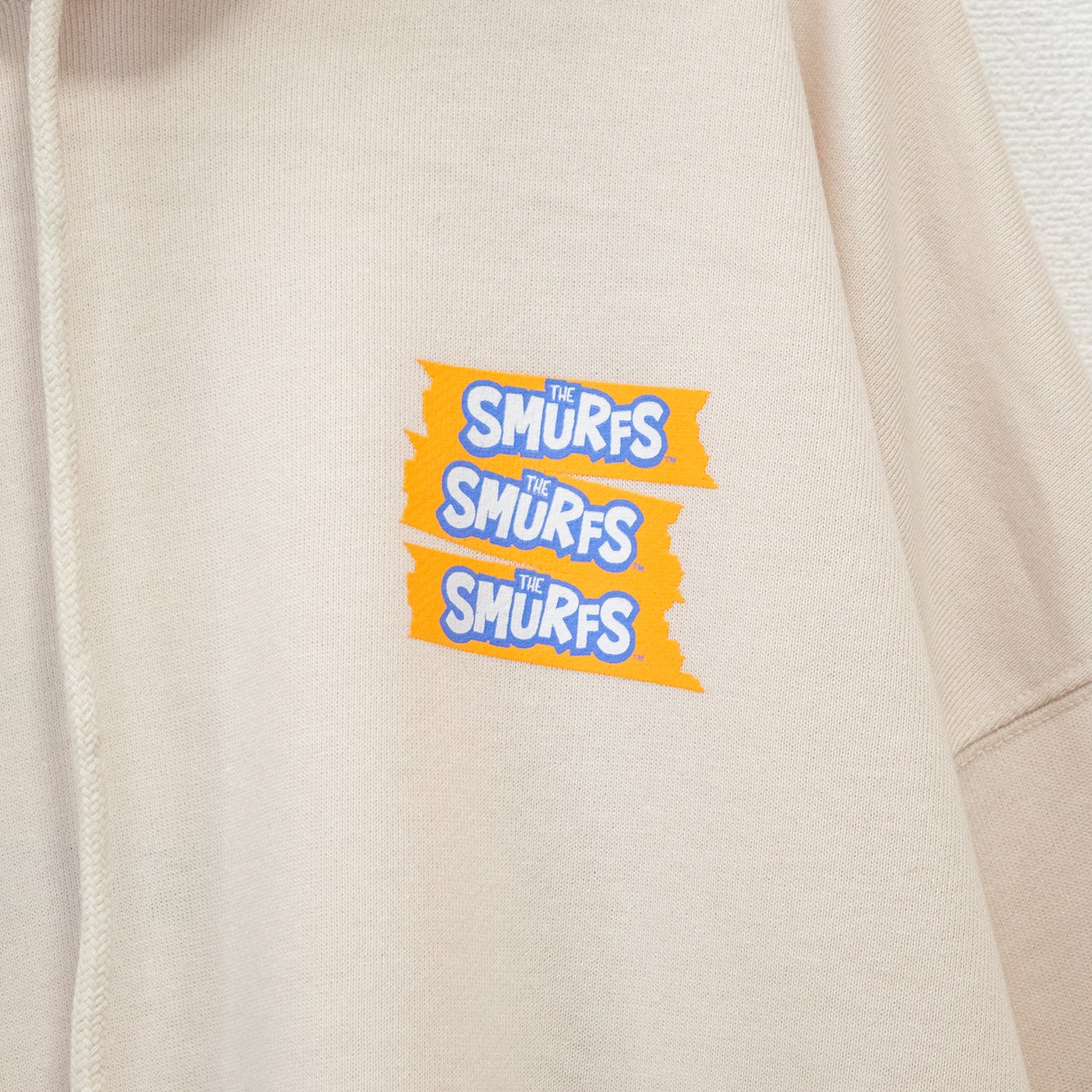 THE SMURFS Smurf SMF Print Pullover Hoodie Off White